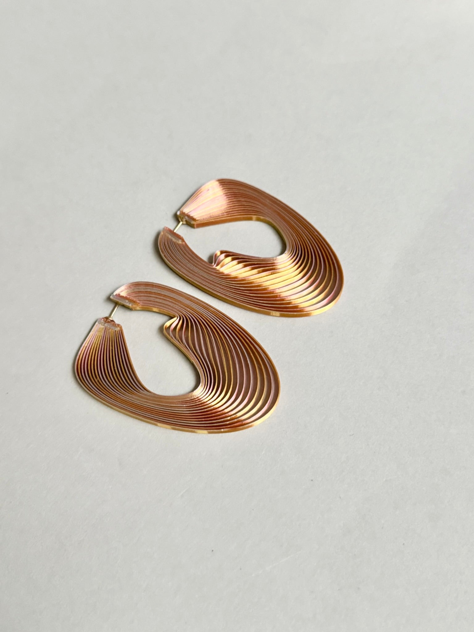 Pink metallic optical art earrings for women