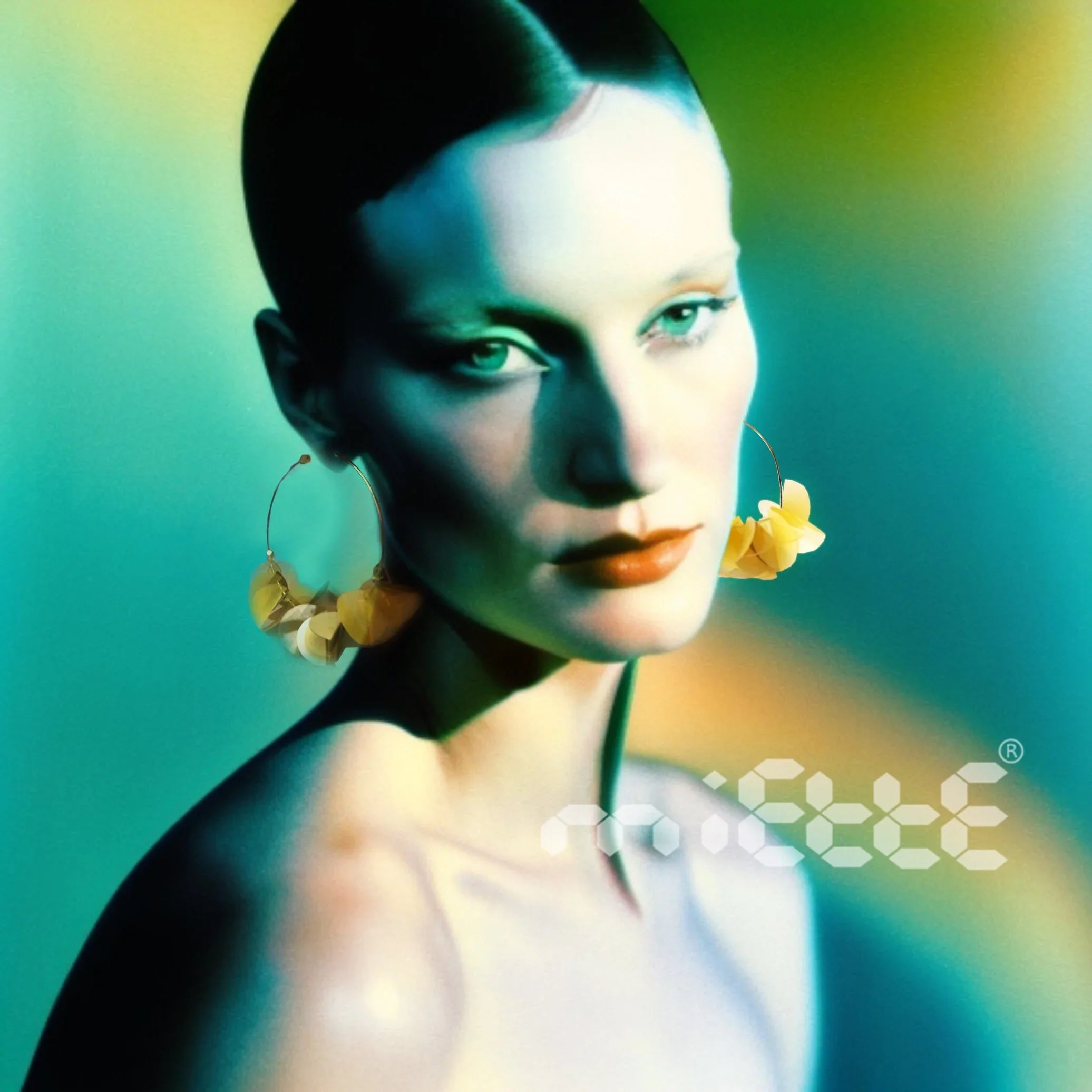 Woman wearing large gold statement earrings with artistic lighting and abstract background