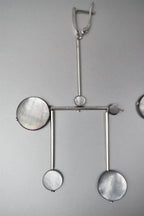 Modern geometric statement earring with silver metal bars and round mother-of-pearl discs