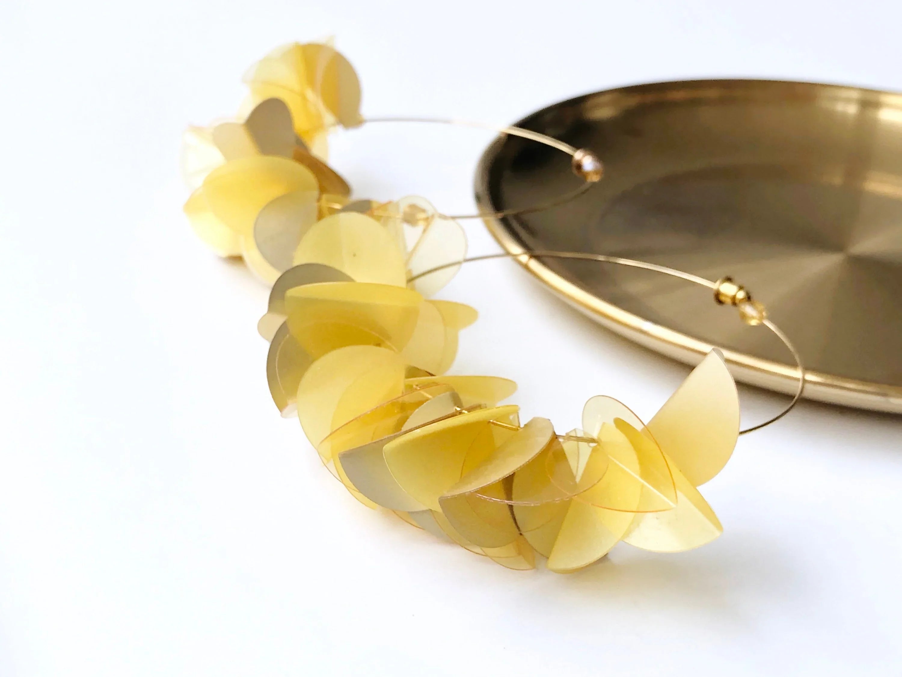 Handmade yellow geometric statement earrings with translucent discs on gold hoop, modern jewelry